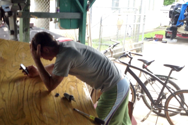 Cain Sergieff with phone and screwdriver