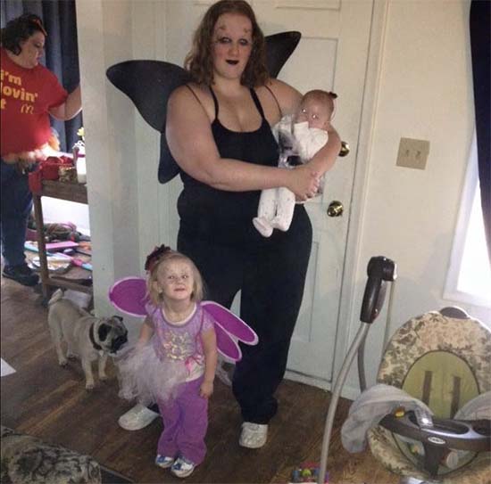 Mary at home with children and dog. Looks like mom Lovin' It in background. 