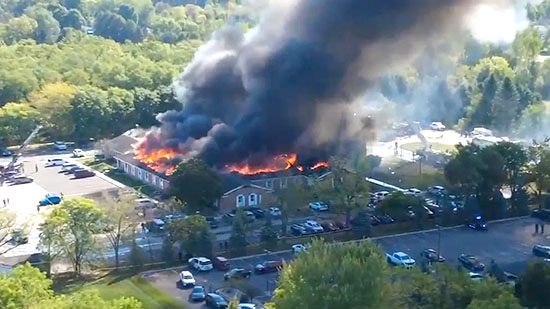 Screenshot: Flames and smoke rise from The Church of Jesus Christ of Latter-day Saints in Grand Blanc, about 50 miles north of Detroit, on Sunday, Sept. 28, 2025. (Julie J, @Malkowski6April via AP)